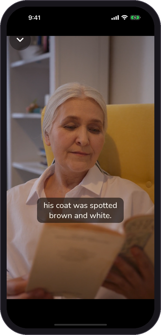 Grandma reading The Velveteen Rabbit in the Sleepy Moon video player, with captions on screen